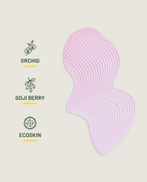 Pink silicone mask with 'Orchid', 'Goji Berry', and 'Ecoskin' labels on a light gray background